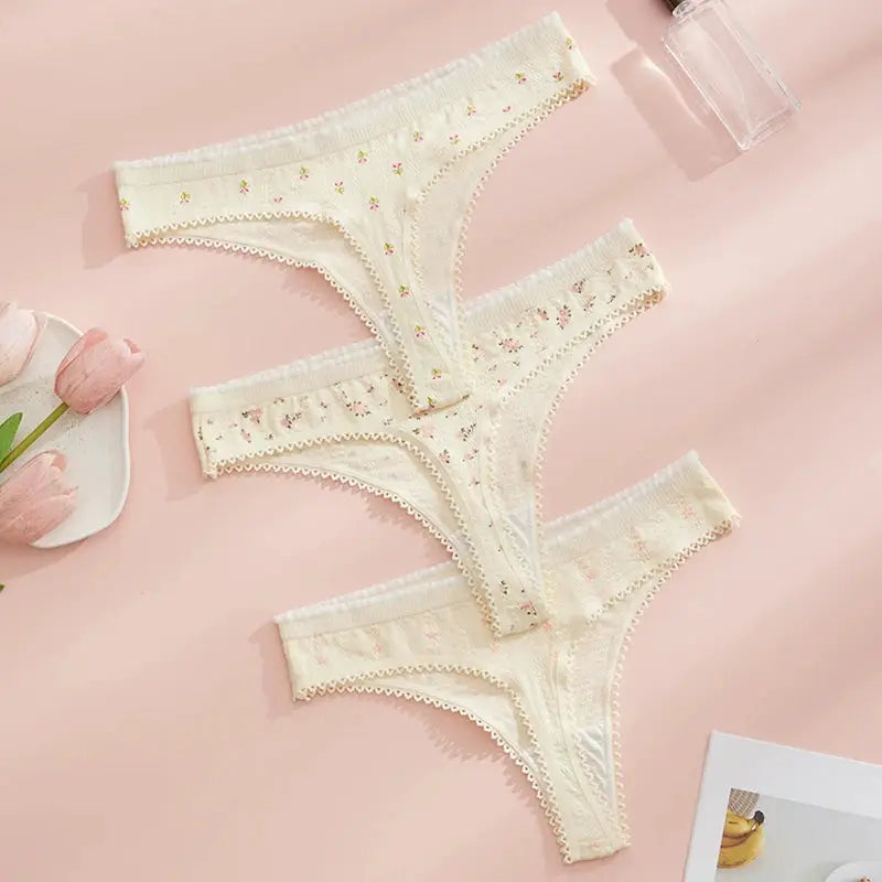 Three ivory floral-print cotton thong panties with lace trim for women by Simples Market