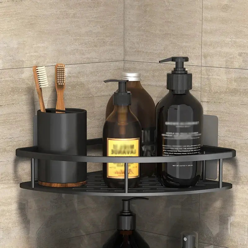 Bathroom corner shelf rack in black metal, wall-mounted no-drill, holds shampoo bottles and toothbrush cup.