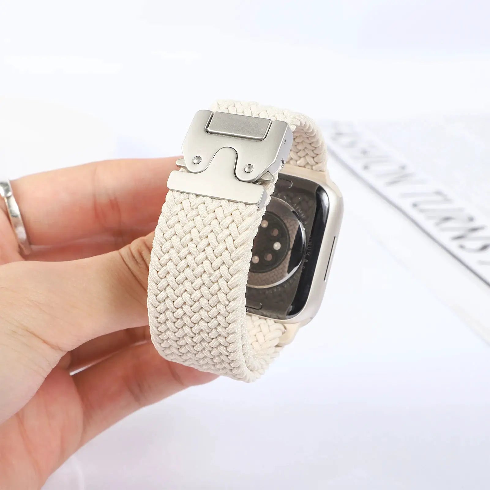 Parachute braided strap for Apple Watch in beige with metal deployment clasp; fits 41–49mm models