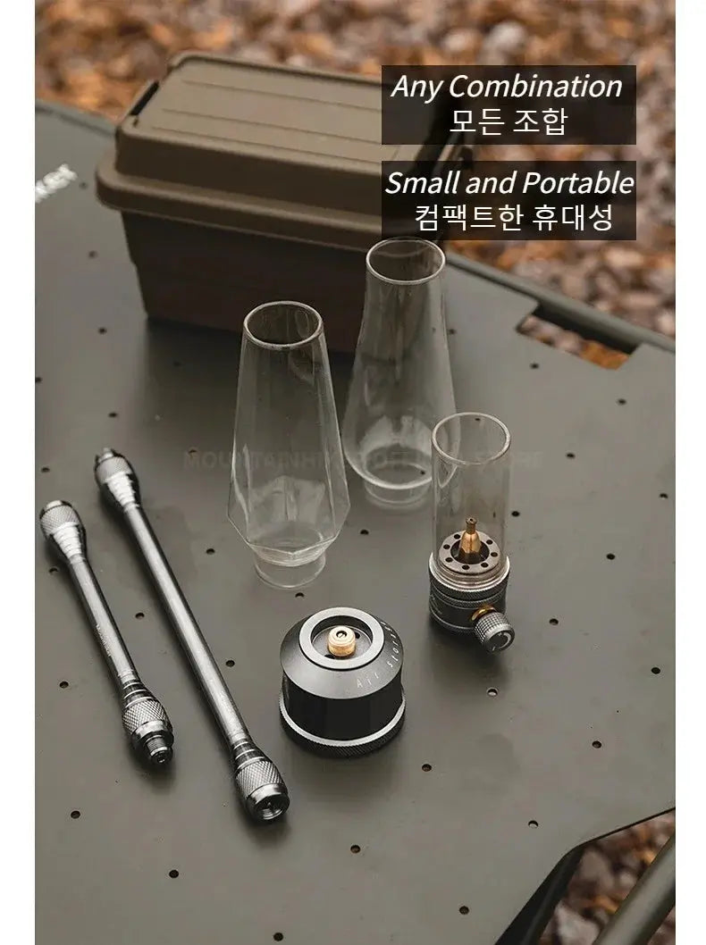 MOUNTAINHIKER outdoor gas light set by Simples Market; compact metal burner with glass vessels and carry case.