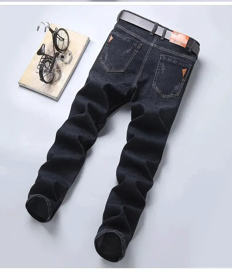 Men's dark denim jeans by Simples Market; slim straight fit with belt and back pockets.