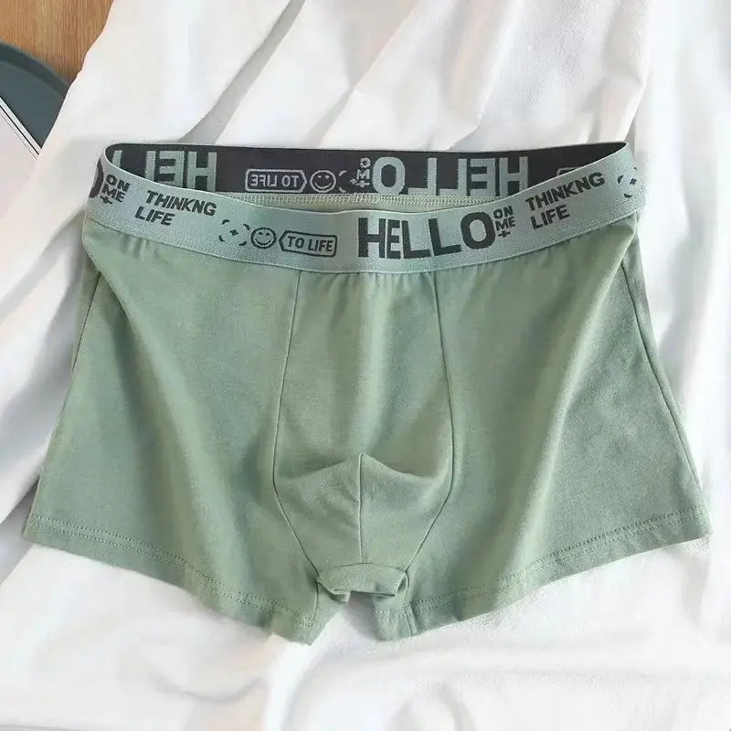 Simples Market men's boxer shorts in sage green with a gray elastic waistband and bold branding