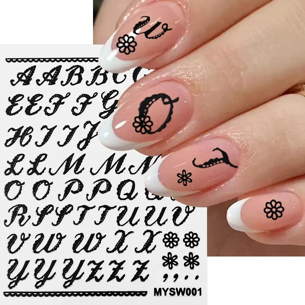 Roman letter nail sticker sheet in black; shown on pink nails with white tips and floral accents.
