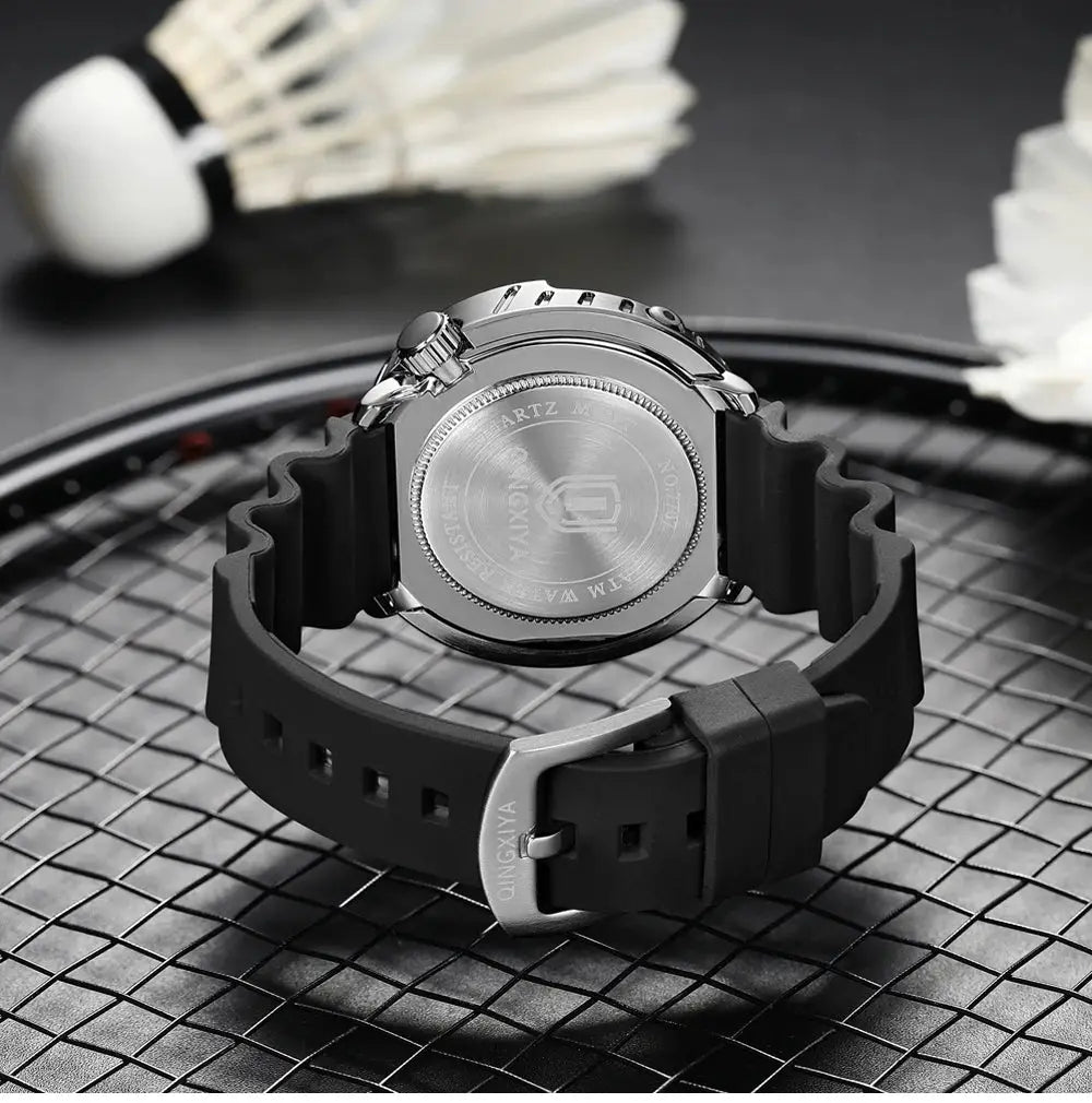 QINGXIYA men's quartz watch with black silicone strap and stainless steel case back