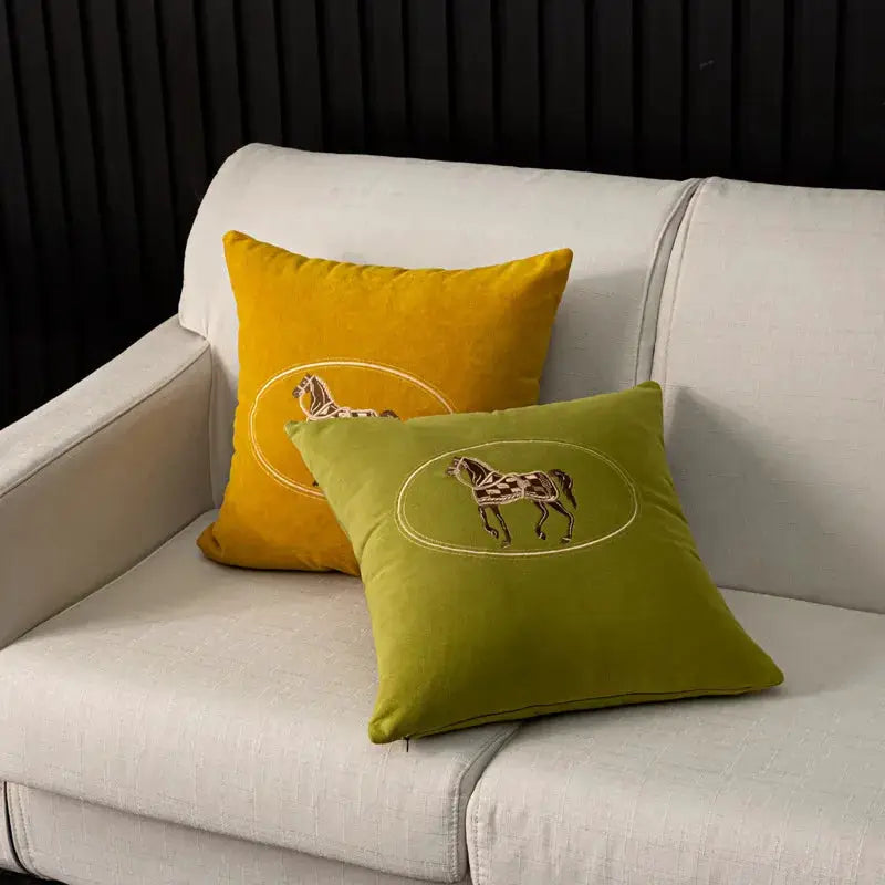 American hand-embroidered horse-pattern cushion covers, 45x45 cm, mustard yellow and olive green, set of 2 on sofa.