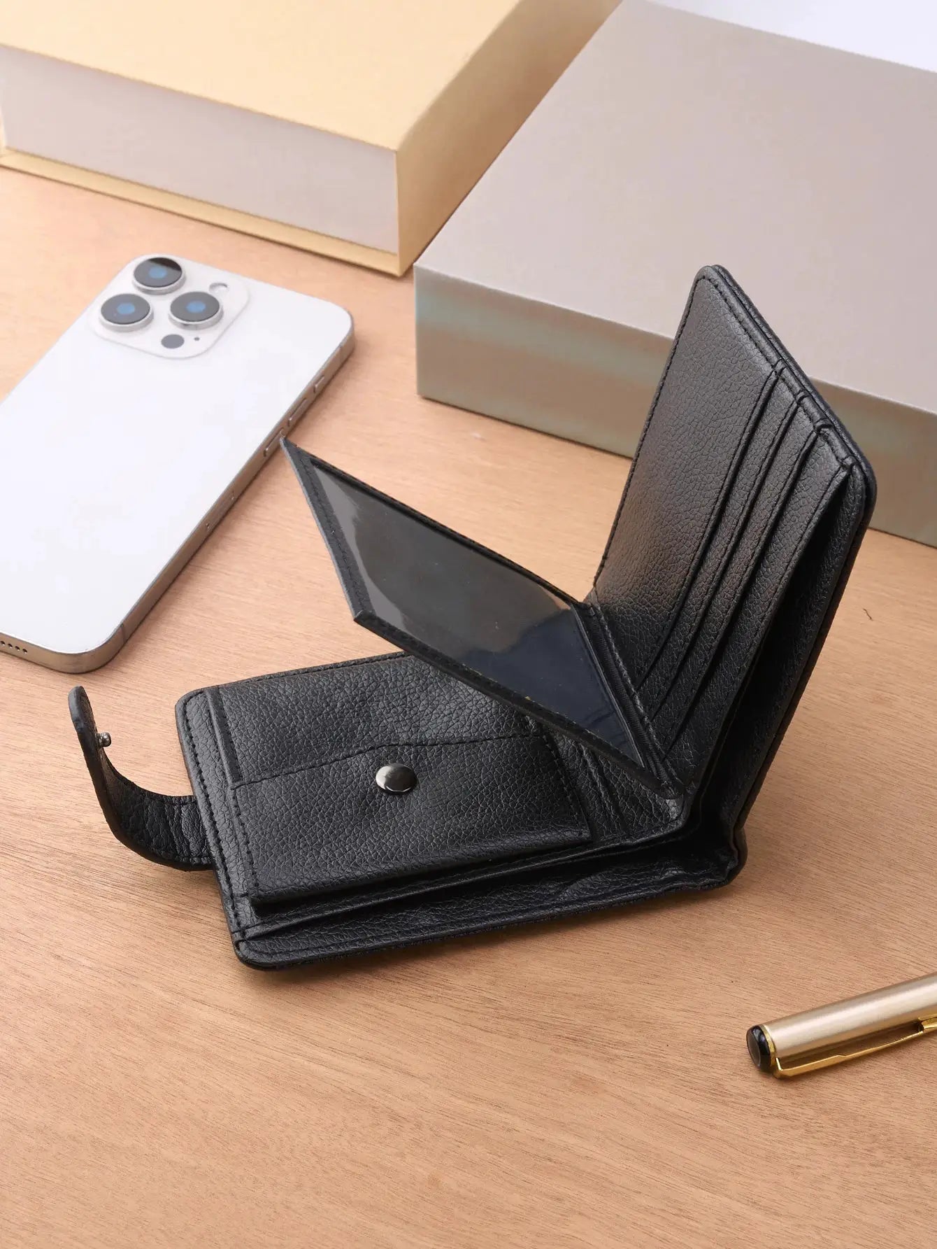 Men's black leather wallet with multiple card slots and coin pocket; slim, textured finish, open view of cards
