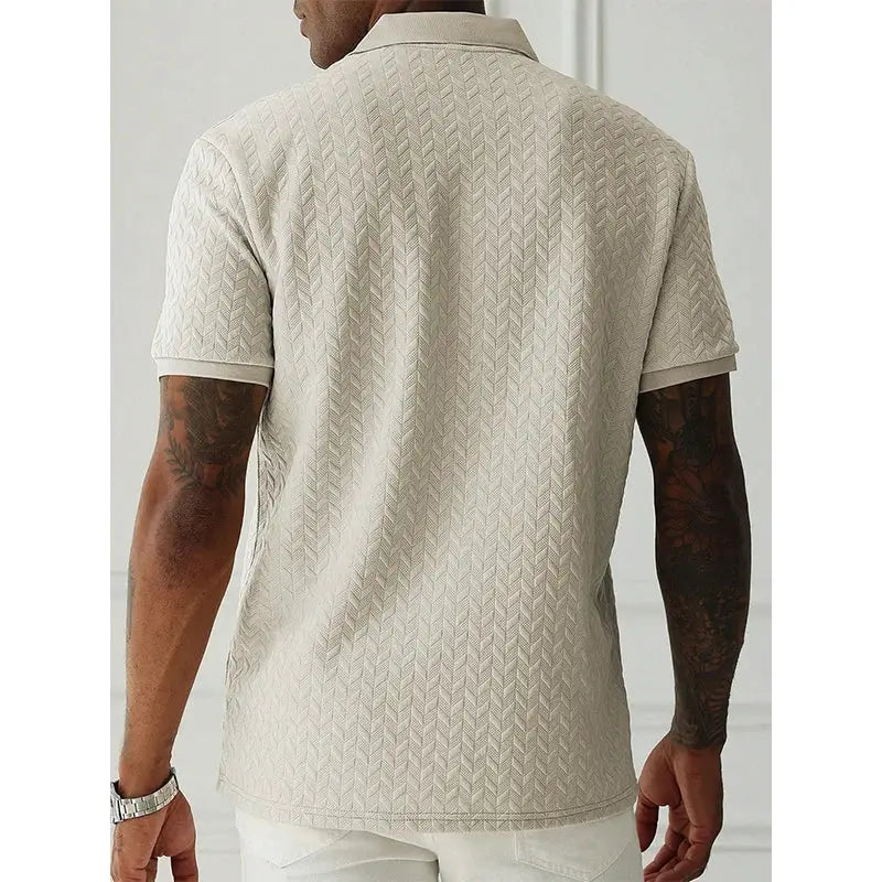 Men's beige polo shirt with short sleeves and textured zigzag pattern.