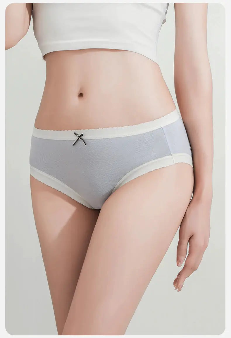 Women's cotton panties in light gray with white scalloped trim, a small front bow, low-rise brief and comfortable.