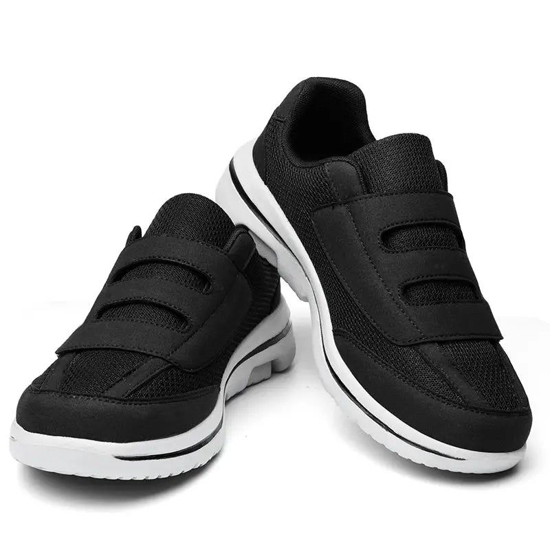 Pair of Simples Market black wide-toe sneakers with Velcro strap closures