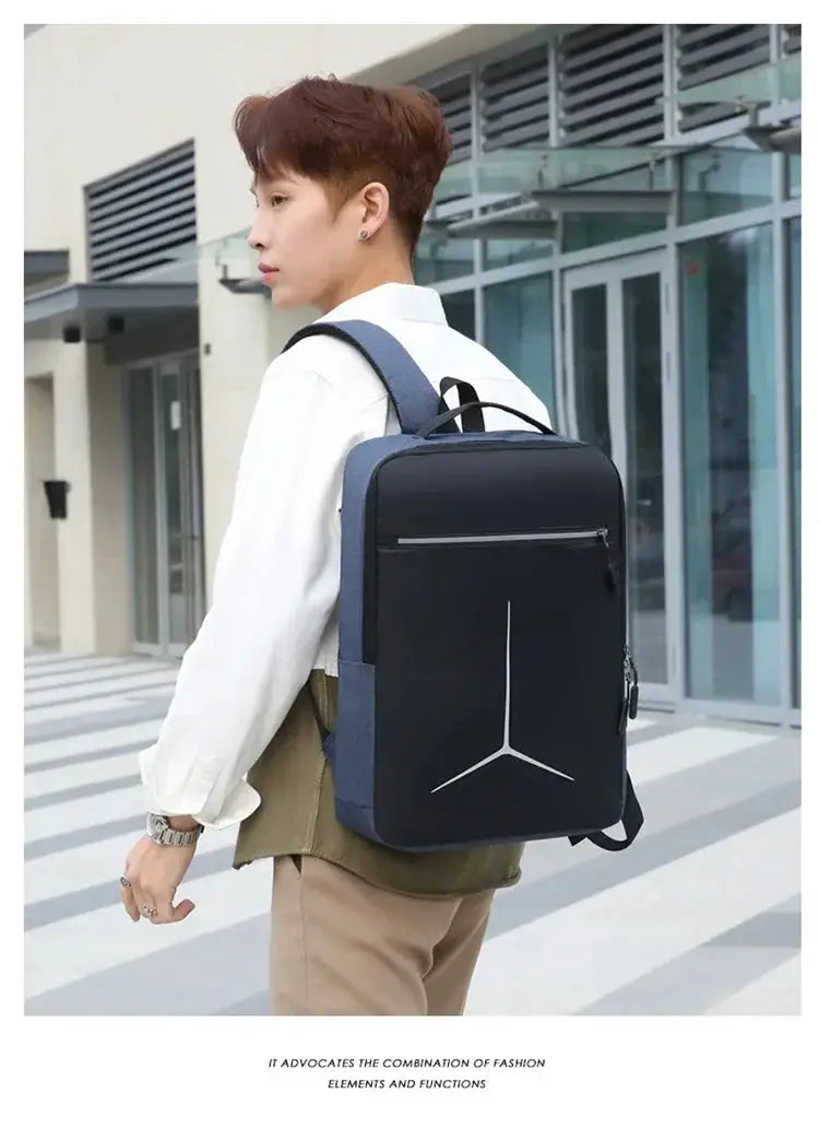 Anti-theft waterproof laptop backpack, black with blue sides, front zip pocket, worn by man.