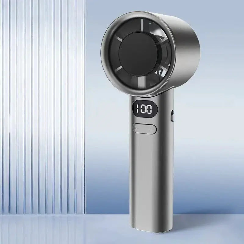 Handheld mini fan by Simples Market, metallic silver with 400mAh battery and USB charging