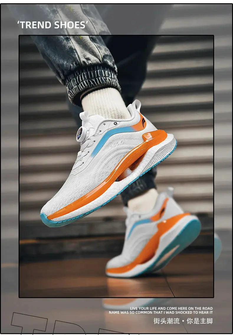 Men's white athletic sneakers with orange midsole, blue outsole and breathable mesh upper