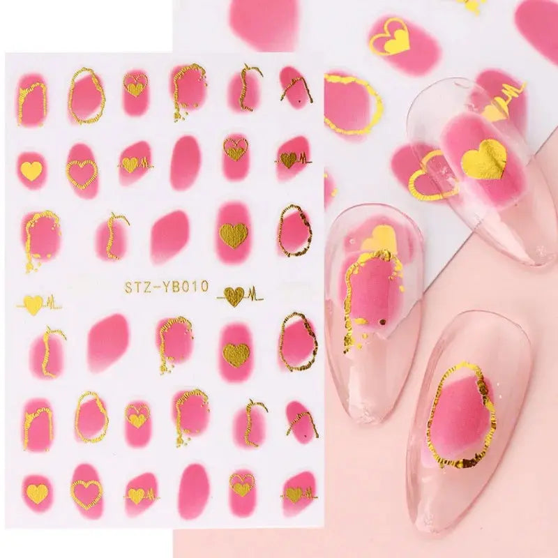 Nail art decals sheet from Simples Market with pink bronzing striped shapes, gold foil outlines and heart accents