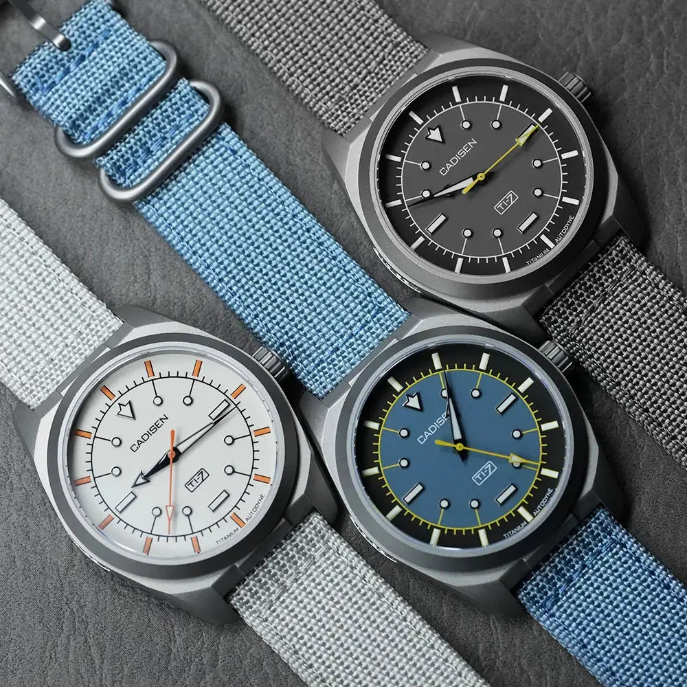 Cadisen TI-7 canvas wristwatches; three titanium-steel case watches with blue, white, and gray dials on canvas straps.