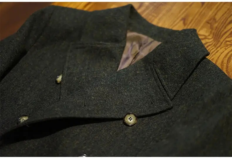 Men's green wool-blend double-breasted overcoat; dark green with buttoned lapels, close-up of chest area