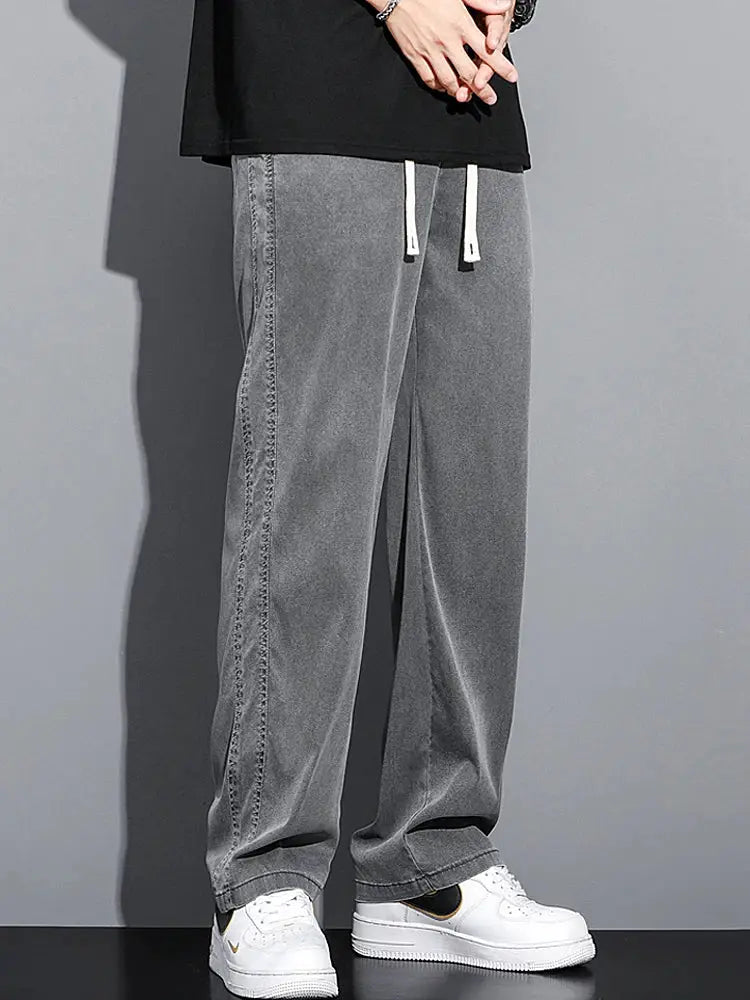 Men's lyocell loose-straight pants with drawstring elastic waist in grey.