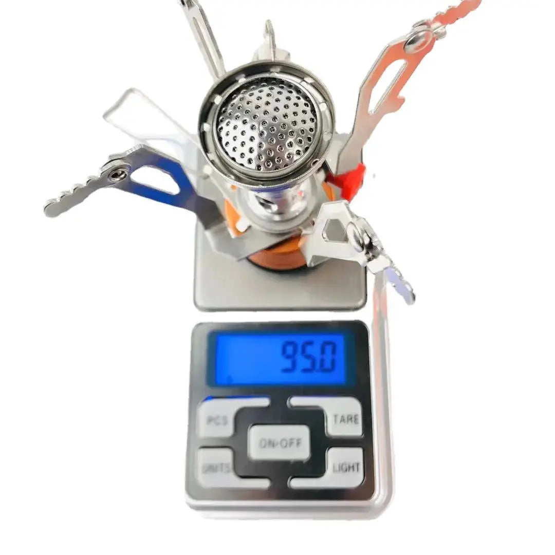Portable aluminum camping gas stove by Simples Market with fold-out pot supports