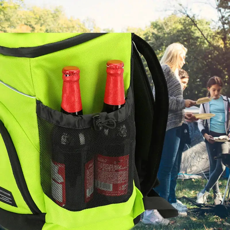 Simples Market insulated cooler backpack in neon green with black mesh bottle pockets holding 2 bottles