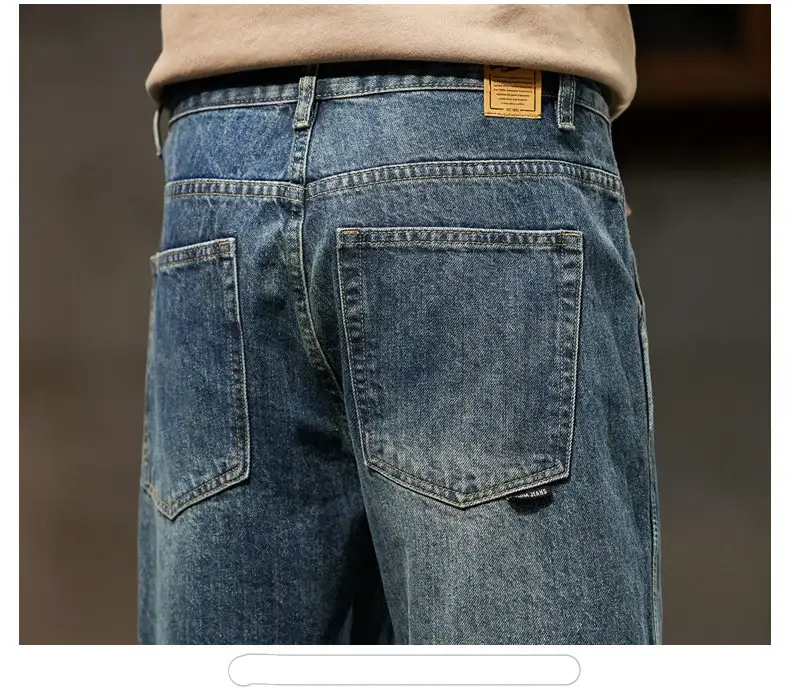 Men's blue denim jeans back view with two back pockets and belt loops