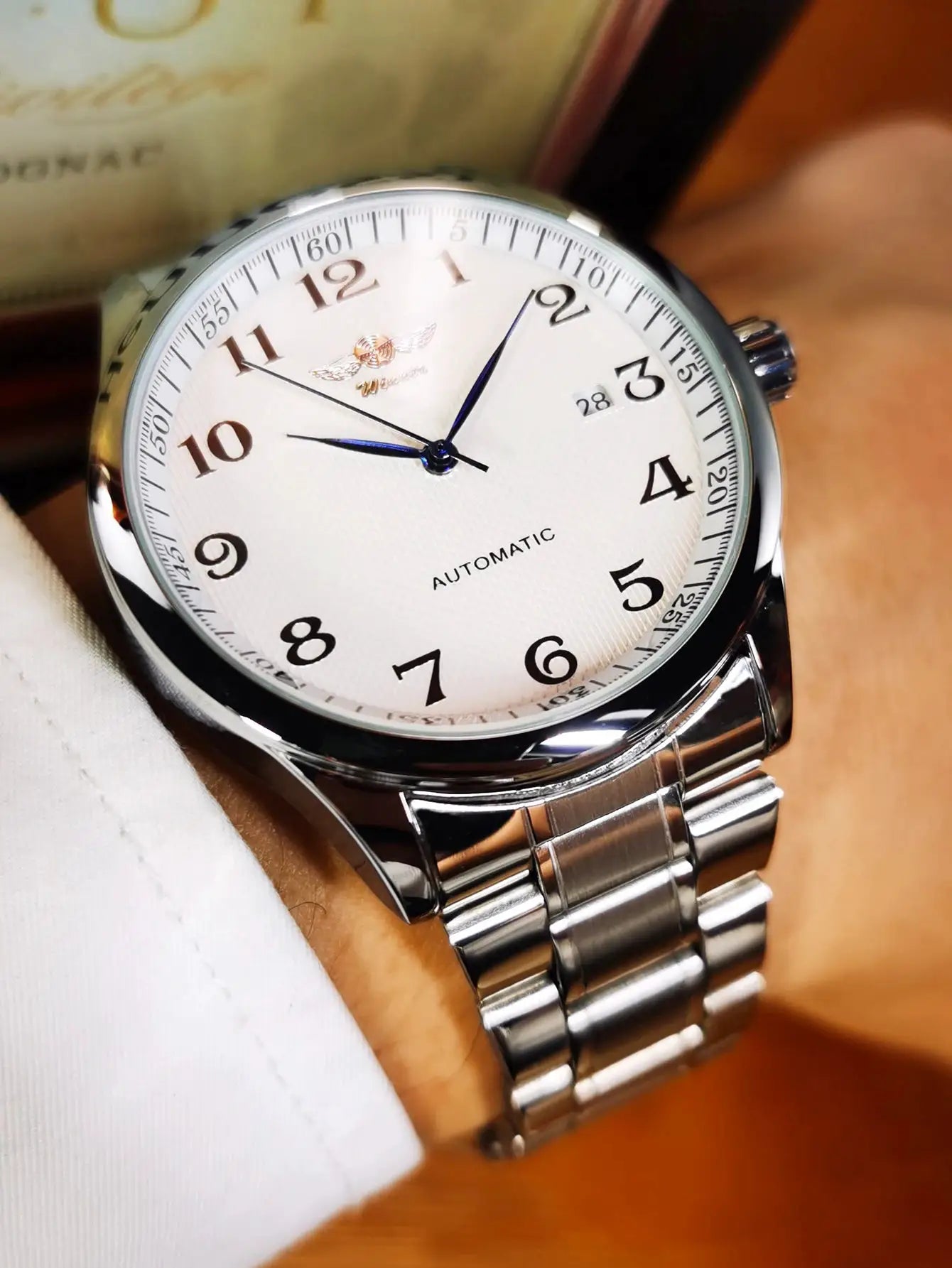 WINNER men's automatic stainless steel watch with white dial and date window on metal bracelet