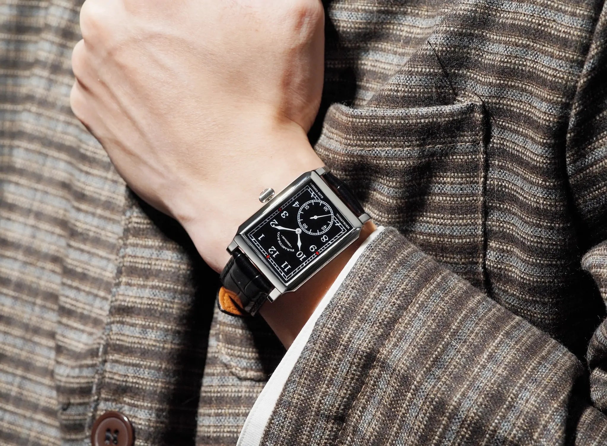 FARASUTE square mechanical wristwatch on wrist; black dial with white numerals, silver case, black leather strap