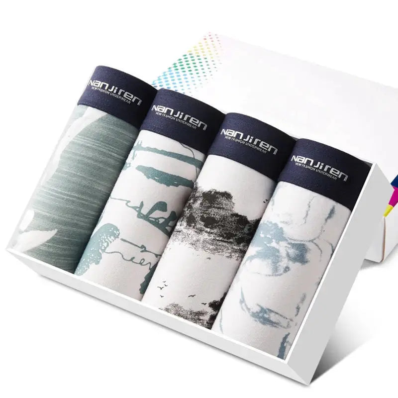 4-pack cotton men’s boxer shorts with navy branded waistbands in assorted prints