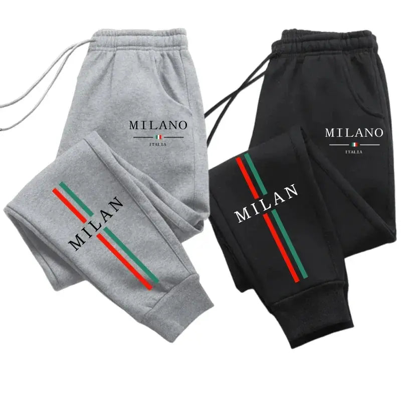 Two Milan city printed jogger pants in gray and black with MILAN logo and Italian stripes