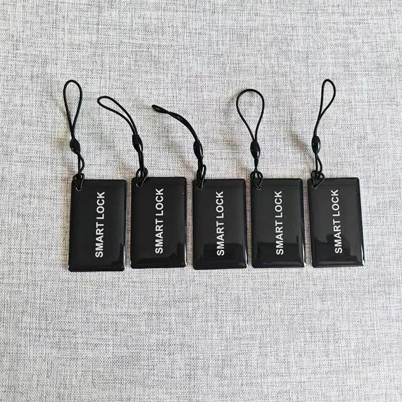 Five black M1 13.56MHz proximity IC cards for smart door locks with straps