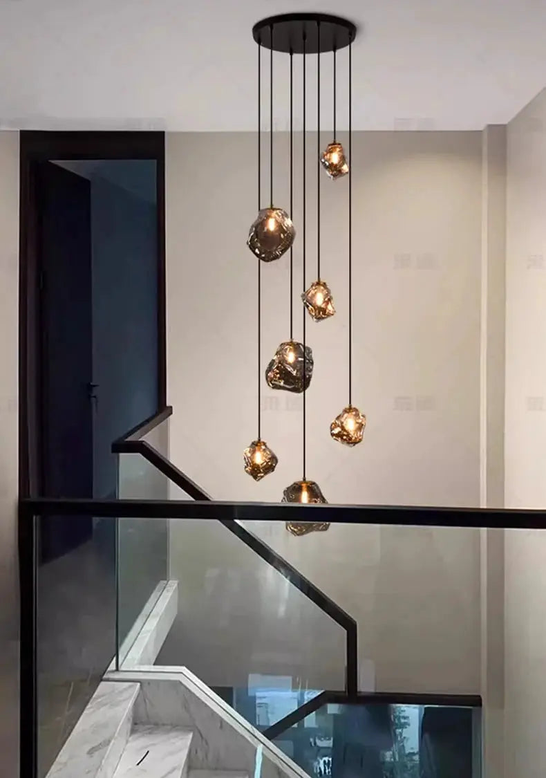 Pendant light chandelier by Simples Market with gem-like amber glass shades for stairs