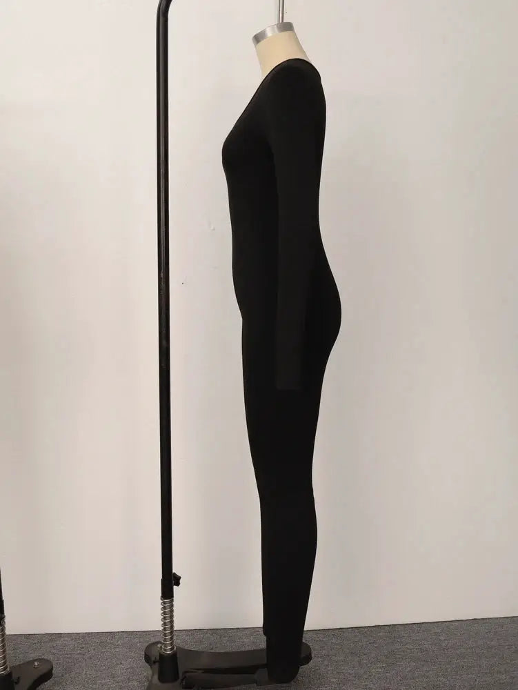 Simples Market women's black long-sleeve skinny jumpsuit, solid color pullover.