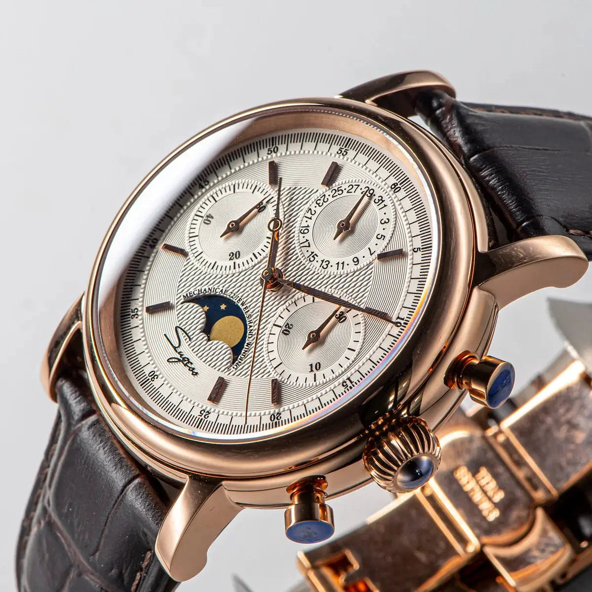 Sugess ST1908 men's mechanical chronograph wristwatch with moonphase, rose gold case, white dial, leather strap.