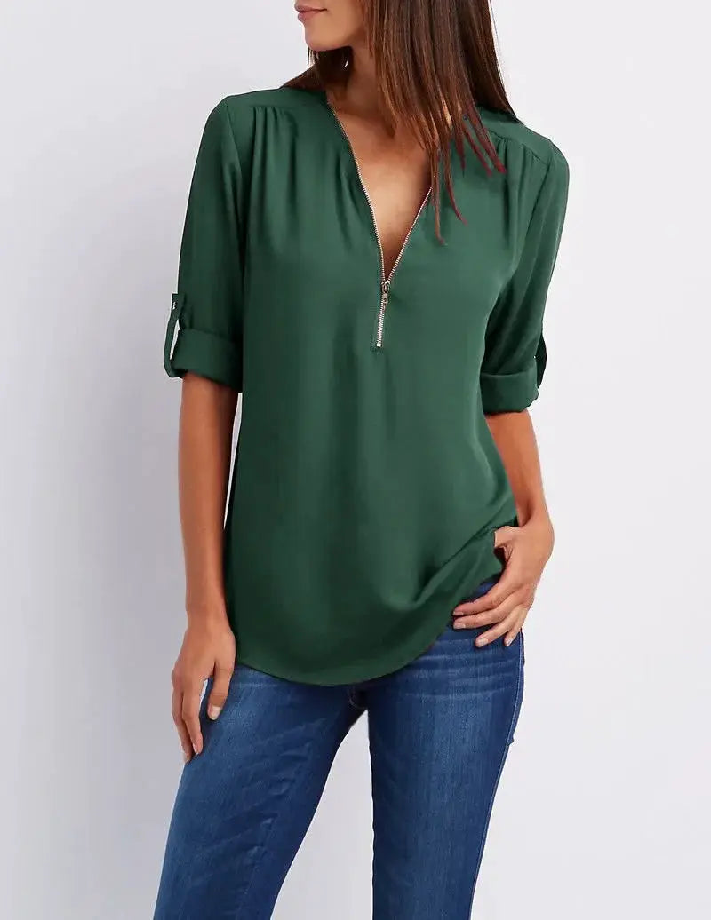 Green chiffon blouse with deep V-neck zipper and rolled sleeves, by Simples Market