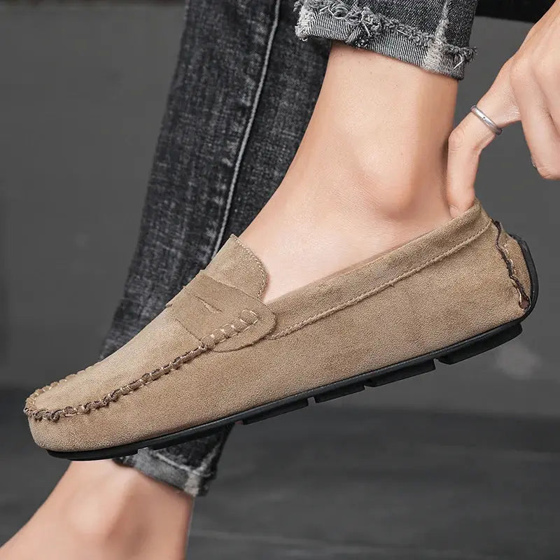 Men's beige suede loafers slip-on with stitched detailing and black sole