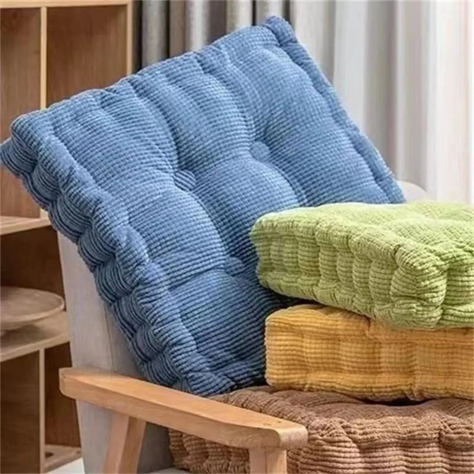 Thick blue square cushion and green textured cushion (two cushions) from Simples Market on a wooden bench