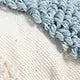 Velvet pillowcase with blue and white irregular geometric loop edging on beige fabric, Bohemian style