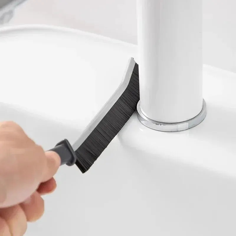 Grout cleaning brush by Simples Market with hard black bristles for tile joints