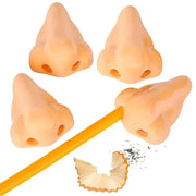 Four peach nose-shaped pencil sharpeners with a pencil and shavings, playful school supplies
