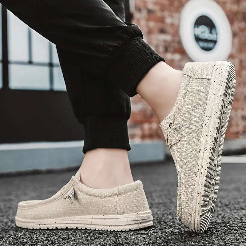 Men's casual canvas loafers in light beige with breathable slip-on design and rugged rubber sole