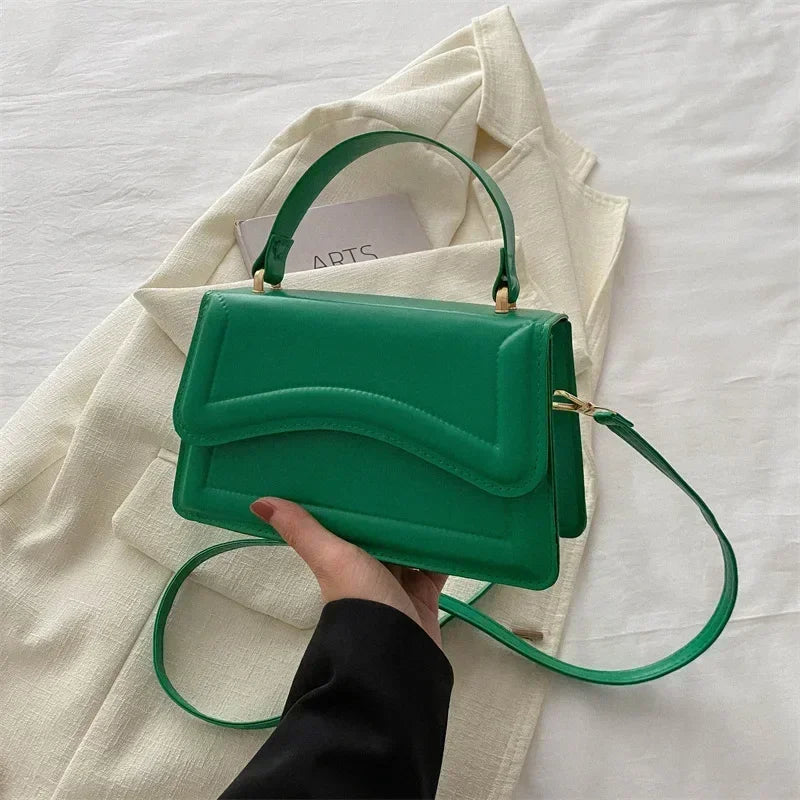 Simples Market green PU leather handbag with top handle and crossbody strap