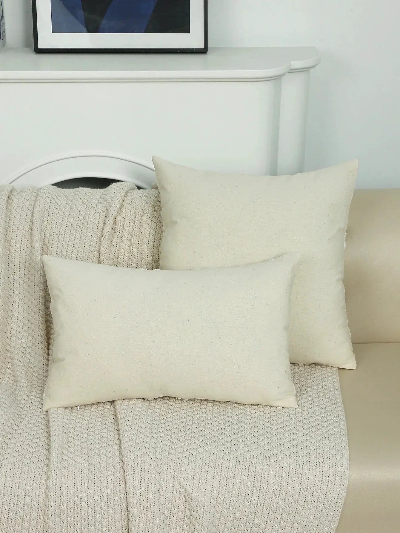 2 cream embroidery throw pillows without inserts, decorative cushions on a beige knitted throw