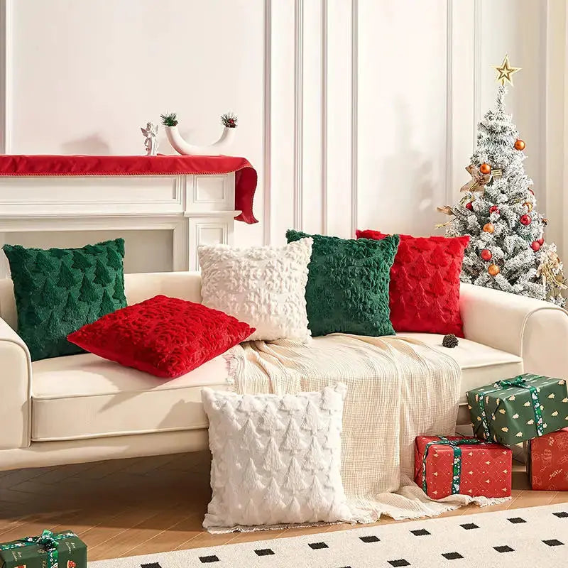 Christmas decorative pillow cover by Simples Market on a white sofa with a white textured cushion and red and green accent pillows