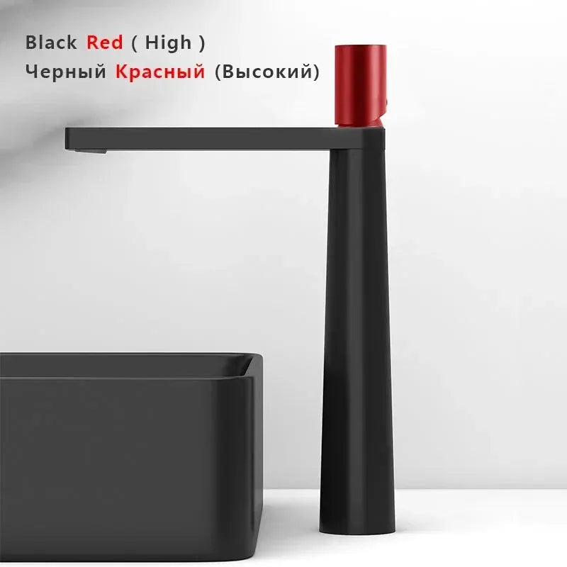 Modern black basin faucet with red cap, tall pillar, single-handle mixer beside grey washbasin