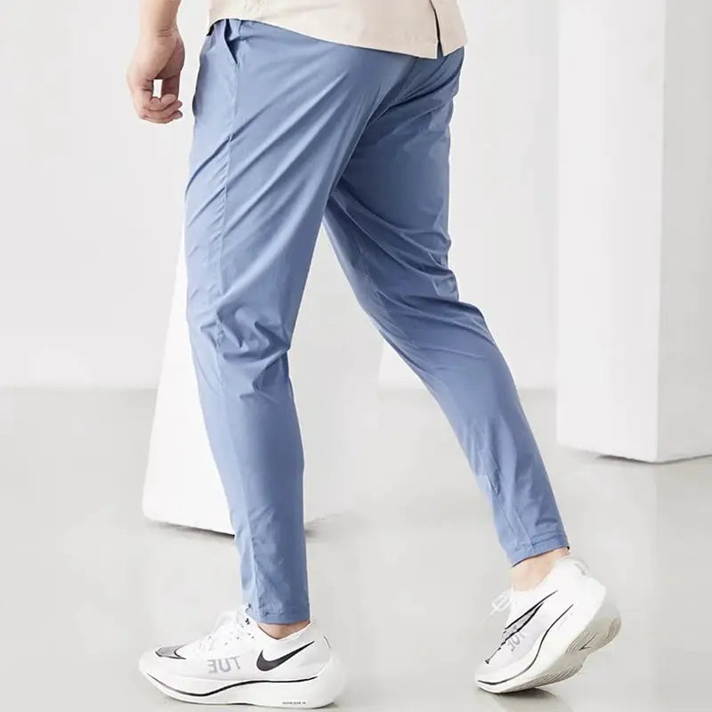 Men's running pants light blue, quick-dry fabric with elastic waistband