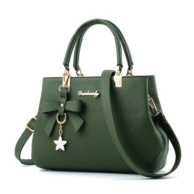 Simples Market green bow handbag with double top handles, removable shoulder strap, gold hardware and star charm