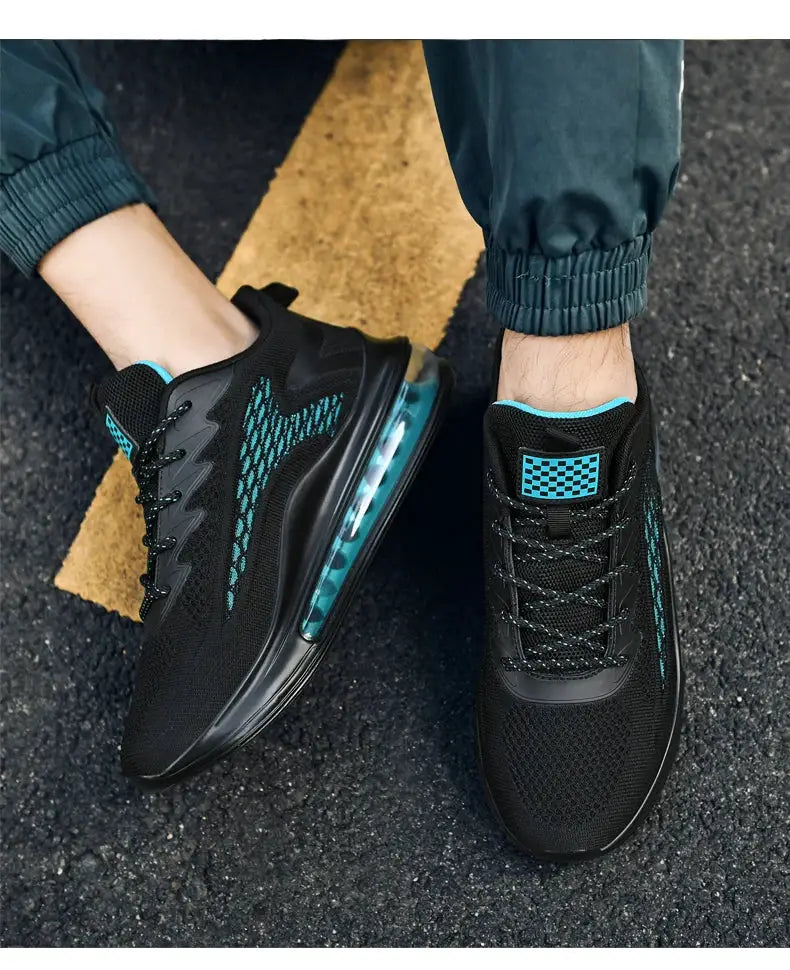 Men's sneakers: pair of black mesh shoes with teal accents and teal air-cushion soles.
