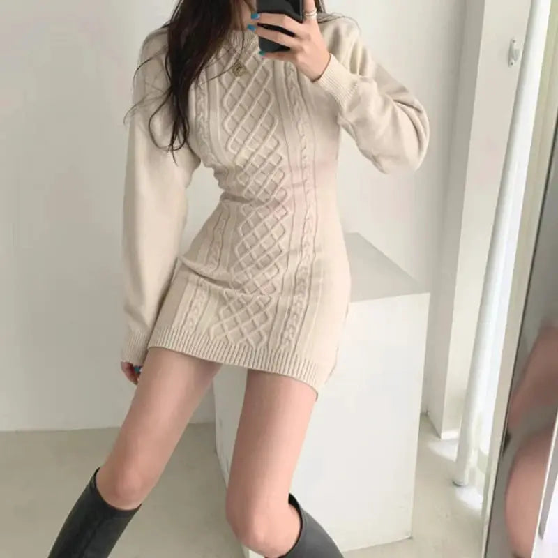 Knit sweater dress in cream with cable panels and long sleeves