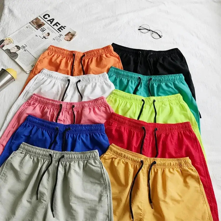 Men's swim shorts in assorted colors with drawstring waists, 12 pairs
