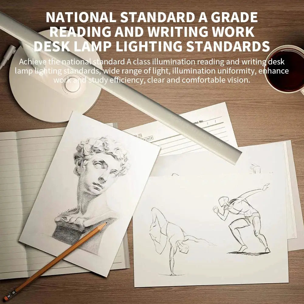 MIJIA Table Lamp 1S Enhanced Version white desk lamp on a wooden desk with sketches