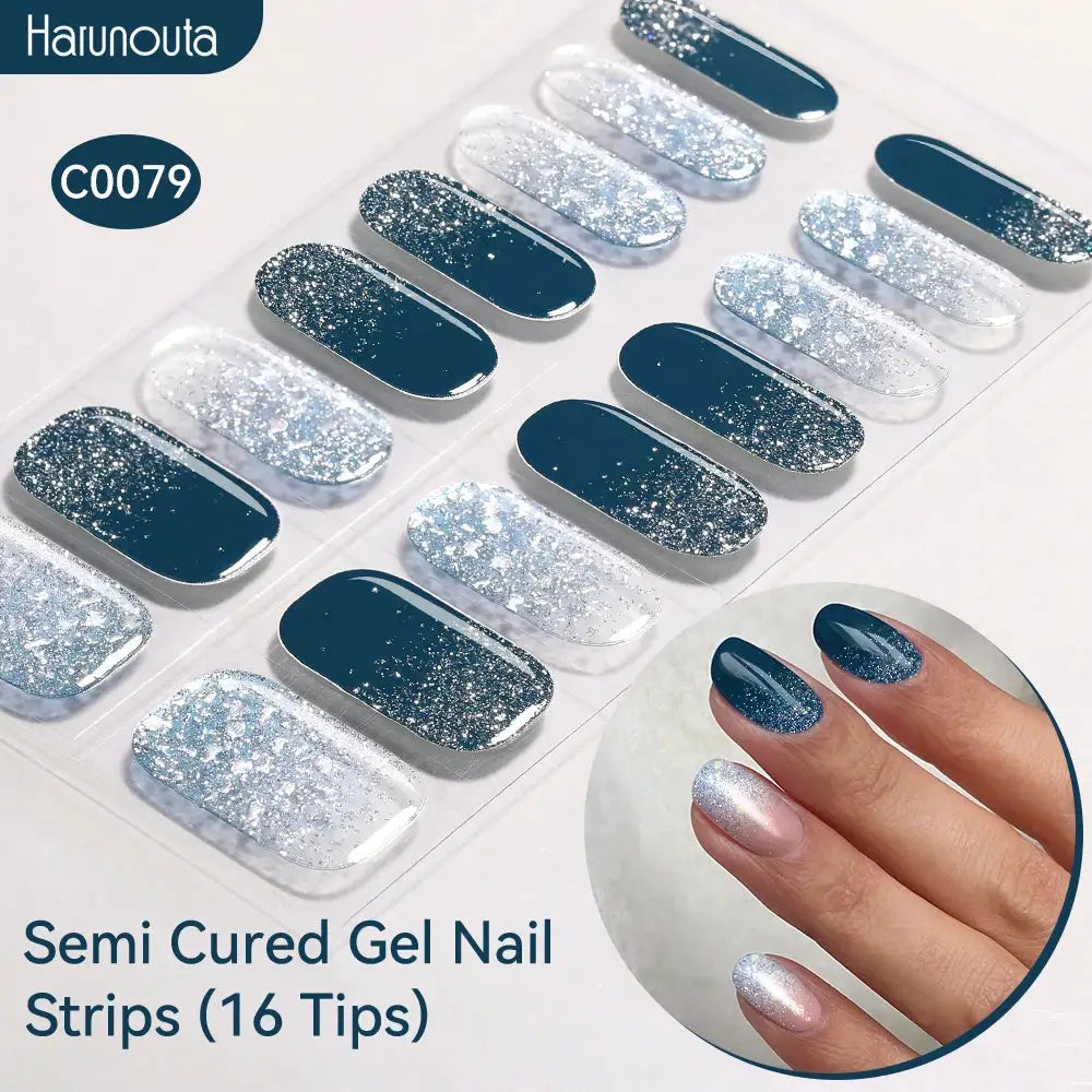 Gradient Auroras semi-cured gel nail strips by Harunouta, 16 tips in dark blue with silver glitter.