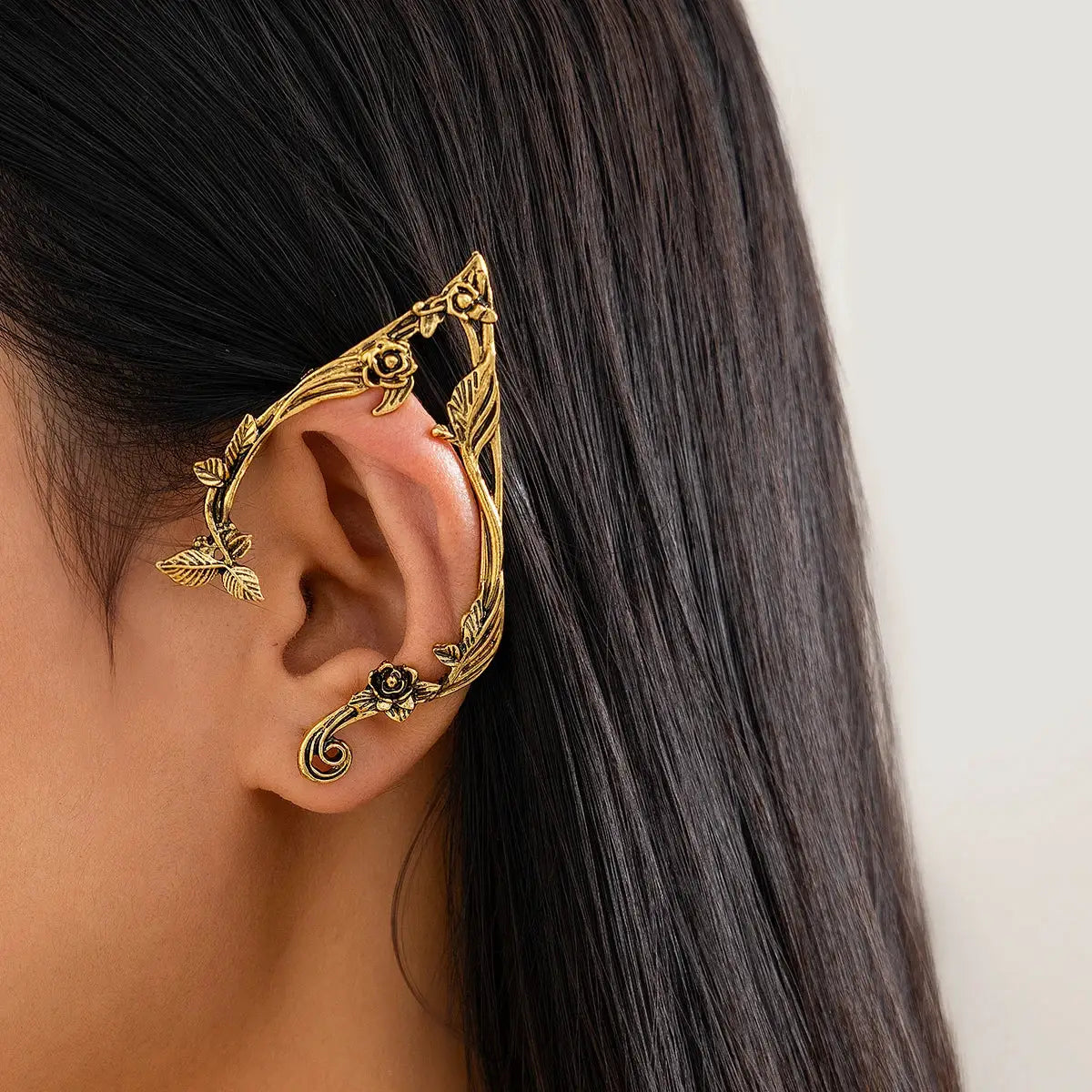Gold-tone elf flower leaf ear clip with floral vine design